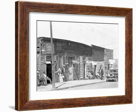 person shop fronts in Vicksburg, Mississippi, 1936-Walker Evans-Framed Photographic Print