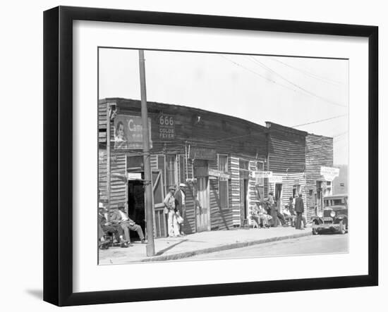 person shop fronts in Vicksburg, Mississippi, 1936-Walker Evans-Framed Photographic Print