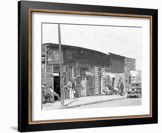 person shop fronts in Vicksburg, Mississippi, 1936-Walker Evans-Framed Photographic Print