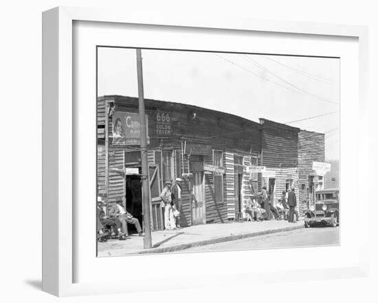 person shop fronts in Vicksburg, Mississippi, 1936-Walker Evans-Framed Photographic Print