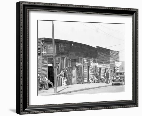 person shop fronts in Vicksburg, Mississippi, 1936-Walker Evans-Framed Photographic Print