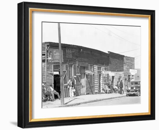 person shop fronts in Vicksburg, Mississippi, 1936-Walker Evans-Framed Photographic Print