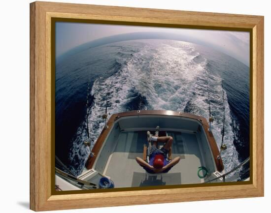 Person Sitting in a Boat-null-Framed Premier Image Canvas