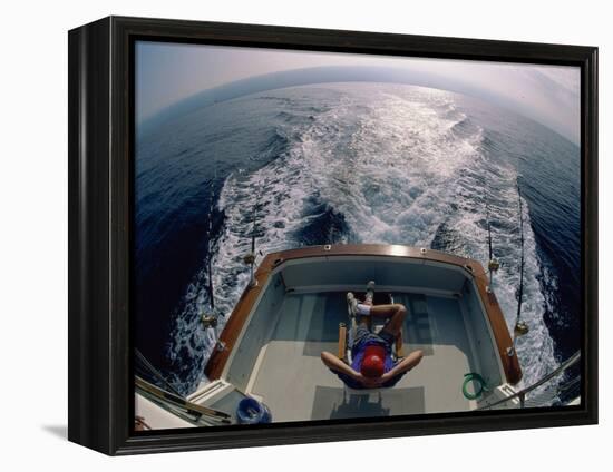 Person Sitting in a Boat-null-Framed Premier Image Canvas