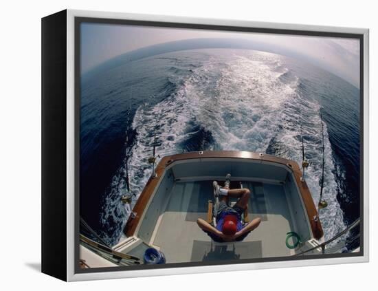 Person Sitting in a Boat-null-Framed Premier Image Canvas