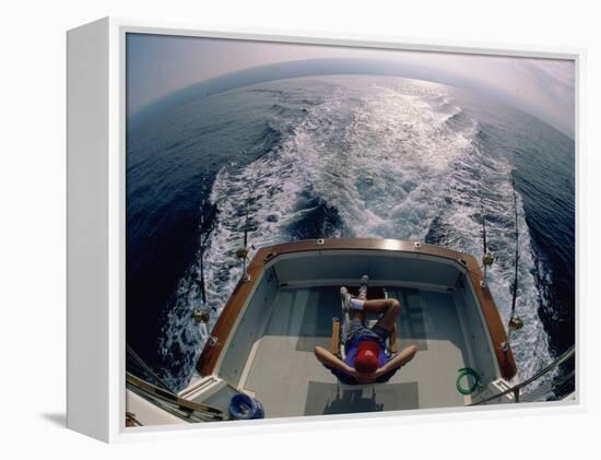 Person Sitting in a Boat-null-Framed Premier Image Canvas