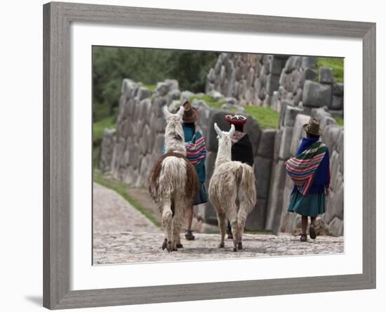 Peru, Native Indian Women Lead their Llamas Past the Ruins of Saqsaywaman-Nigel Pavitt-Framed Photographic Print