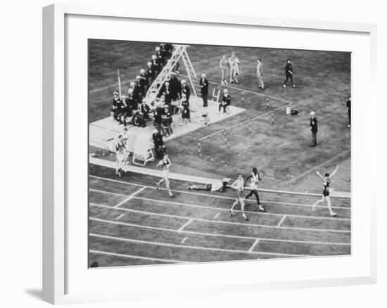 Peter Snell Raising Arms in Celebration After Winning 800 Meter Race at the Summer Olympic Games-George Silk-Framed Premium Photographic Print