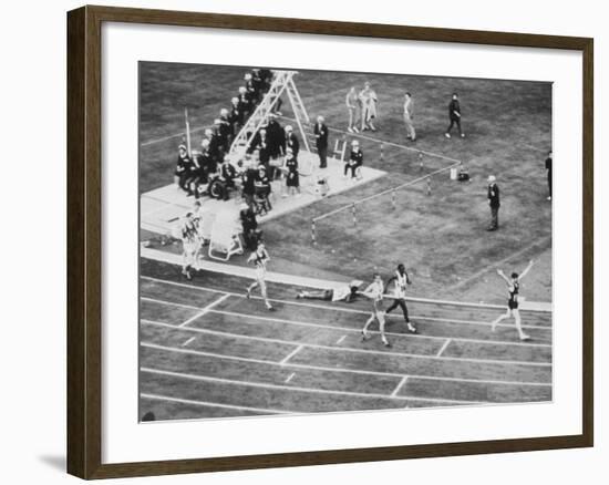 Peter Snell Raising Arms in Celebration After Winning 800 Meter Race at the Summer Olympic Games-George Silk-Framed Premium Photographic Print