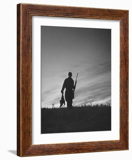 Pheasant Hunter Carrying Bird That He Killed-Wallace Kirkland-Framed Photographic Print