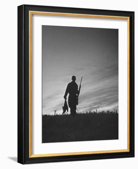 Pheasant Hunter Carrying Bird That He Killed-Wallace Kirkland-Framed Photographic Print