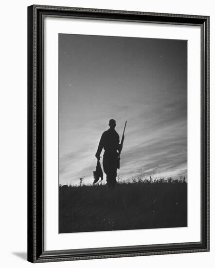 Pheasant Hunter Carrying Bird That He Killed-Wallace Kirkland-Framed Photographic Print