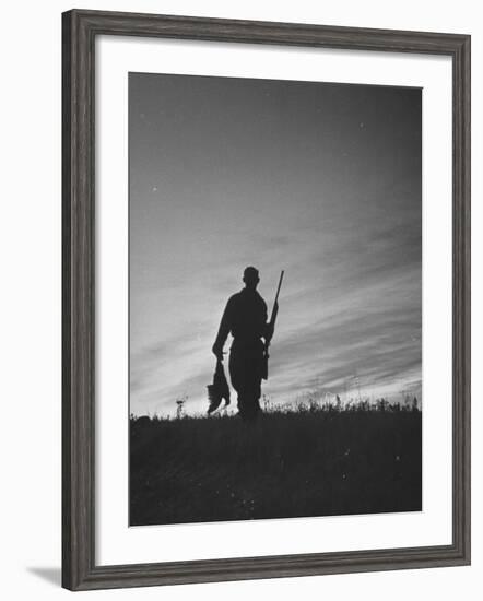 Pheasant Hunter Carrying Bird That He Killed-Wallace Kirkland-Framed Photographic Print