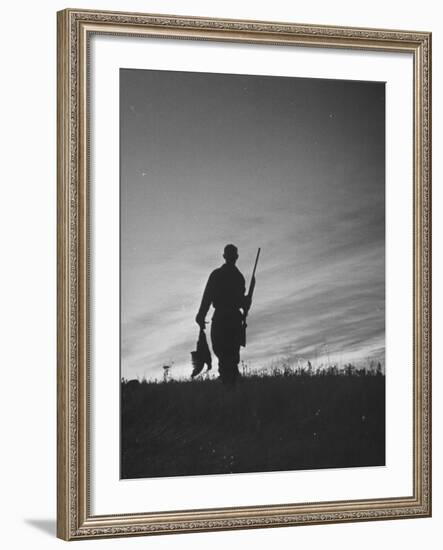 Pheasant Hunter Carrying Bird That He Killed-Wallace Kirkland-Framed Photographic Print