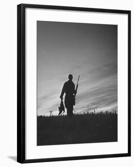 Pheasant Hunter Carrying Bird That He Killed-Wallace Kirkland-Framed Photographic Print