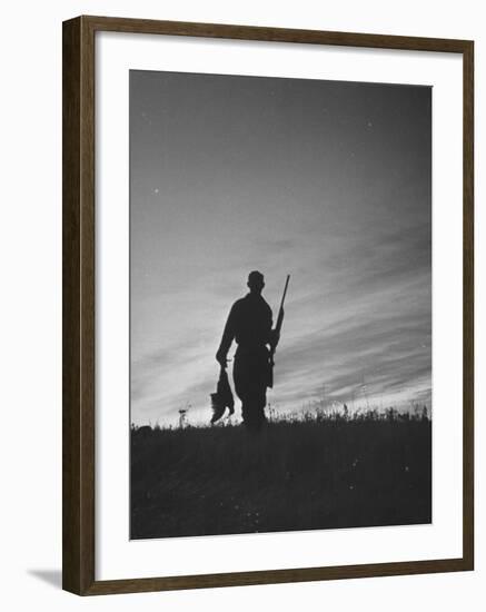 Pheasant Hunter Carrying Bird That He Killed-Wallace Kirkland-Framed Photographic Print