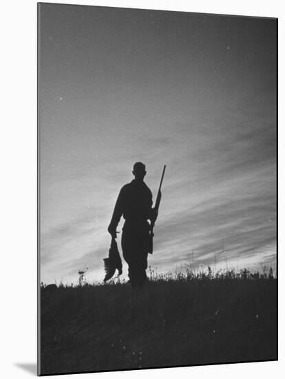 Pheasant Hunter Carrying Bird That He Killed-Wallace Kirkland-Mounted Photographic Print
