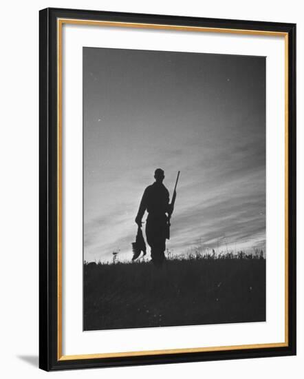 Pheasant Hunter Carrying Bird That He Killed-Wallace Kirkland-Framed Photographic Print