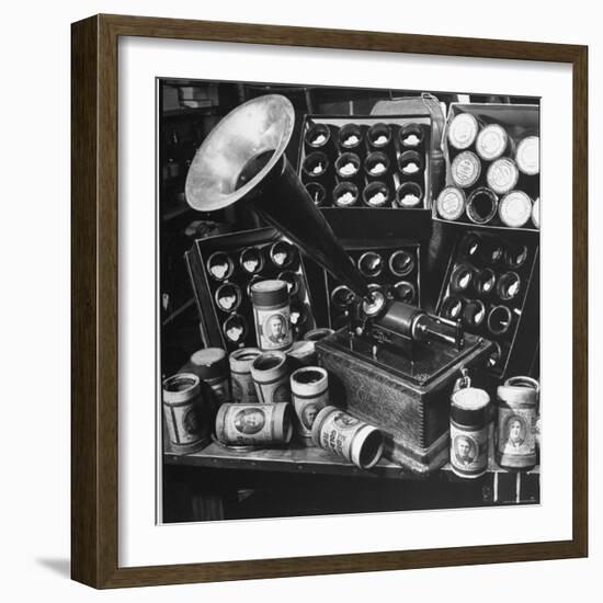 Phonograph Invented by Thomas A. Edison Sitting on Table with Boxes of Cylindrical Records-Walter Sanders-Framed Photographic Print