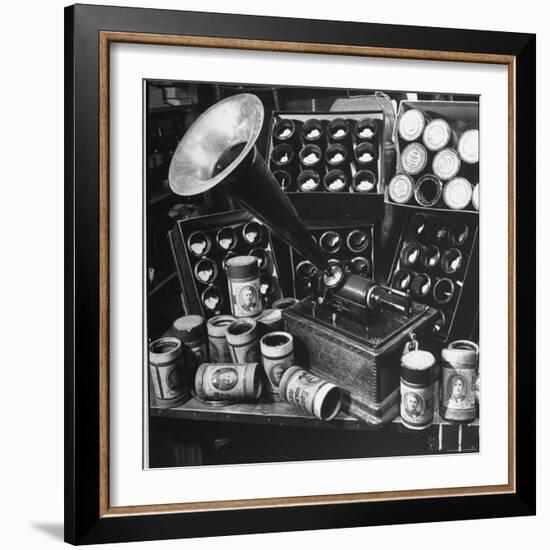 Phonograph Invented by Thomas A. Edison Sitting on Table with Boxes of Cylindrical Records-Walter Sanders-Framed Photographic Print