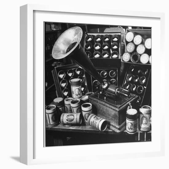 Phonograph Invented by Thomas A. Edison Sitting on Table with Boxes of Cylindrical Records-Walter Sanders-Framed Photographic Print