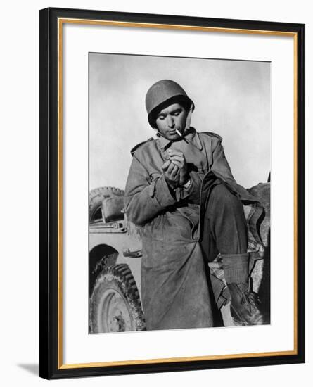 Photographer Robert Capa Pausing for a Smoke While on Duty at the Tunisian Front-null-Framed Premium Photographic Print