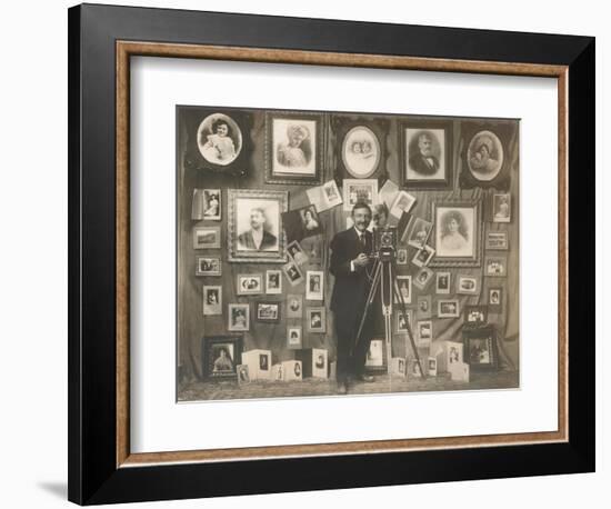 Photographer with his Work-null-Framed Art Print