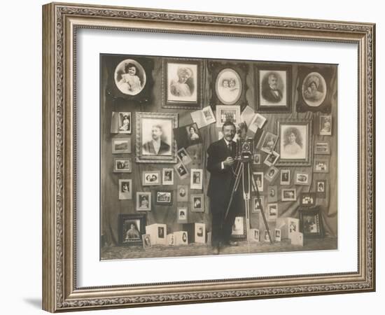 Photographer with his Work-null-Framed Art Print