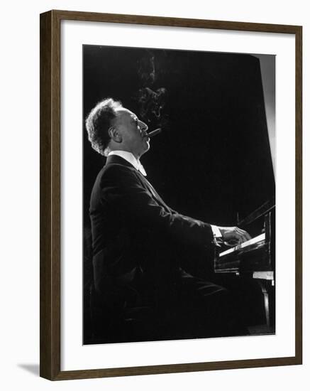 Pianist Arthur Rubenstein at the Piano, Smoking Cigar-Gjon Mili-Framed Premium Photographic Print