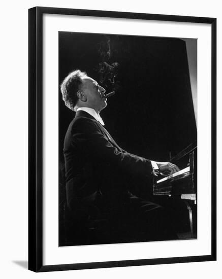 Pianist Arthur Rubenstein at the Piano, Smoking Cigar-Gjon Mili-Framed Premium Photographic Print