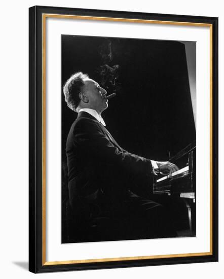 Pianist Arthur Rubenstein at the Piano, Smoking Cigar-Gjon Mili-Framed Premium Photographic Print