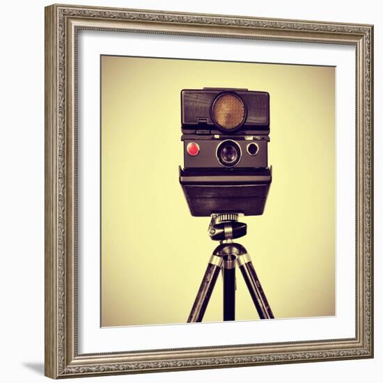 Picture of an Old Instant Camera in a Tripod with a Retro Effect-nito-Framed Photographic Print