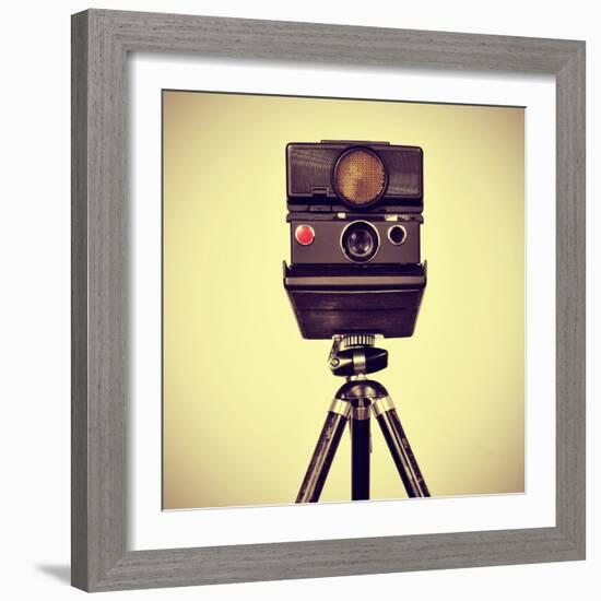 Picture of an Old Instant Camera in a Tripod with a Retro Effect-nito-Framed Photographic Print