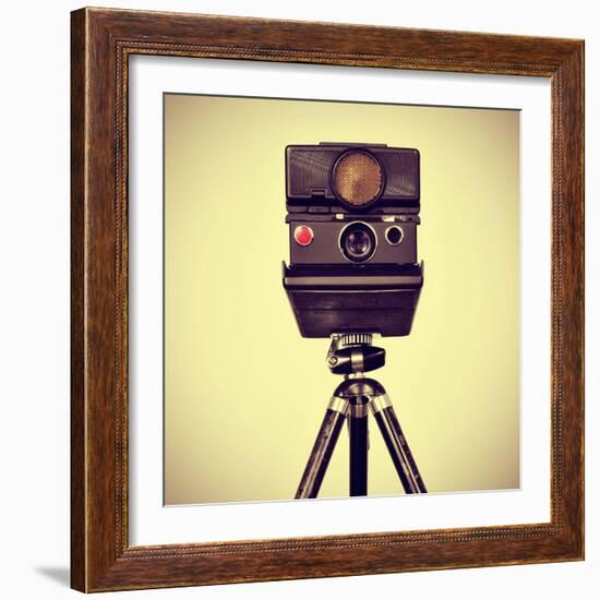 Picture of an Old Instant Camera in a Tripod with a Retro Effect-nito-Framed Photographic Print