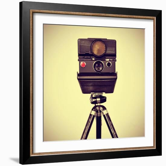 Picture of an Old Instant Camera in a Tripod with a Retro Effect-nito-Framed Photographic Print