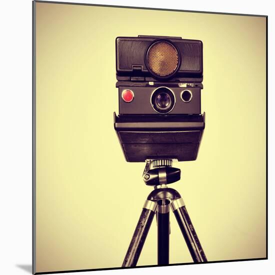 Picture of an Old Instant Camera in a Tripod with a Retro Effect-nito-Mounted Photographic Print