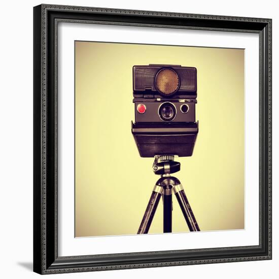 Picture of an Old Instant Camera in a Tripod with a Retro Effect-nito-Framed Photographic Print