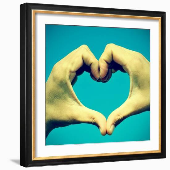 Picture Of Man Hands Forming A Heart Over The Blue Sky, With A Retro Effect-nito-Framed Art Print