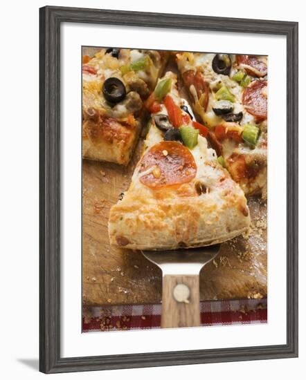 Piece of Pepperoni Pizza with Peppers and Olives on Server-null-Framed Photographic Print