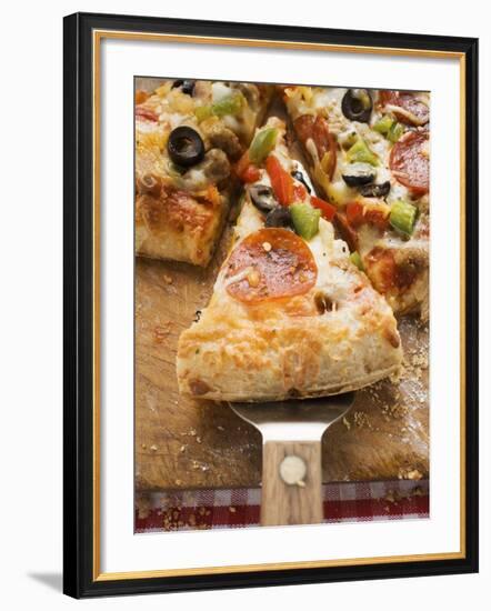 Piece of Pepperoni Pizza with Peppers and Olives on Server-null-Framed Photographic Print