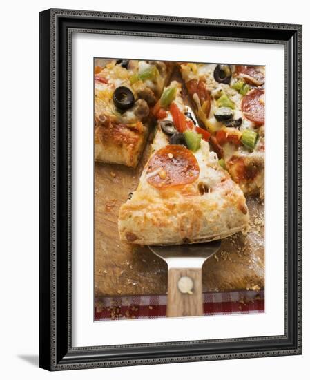 Piece of Pepperoni Pizza with Peppers and Olives on Server-null-Framed Photographic Print