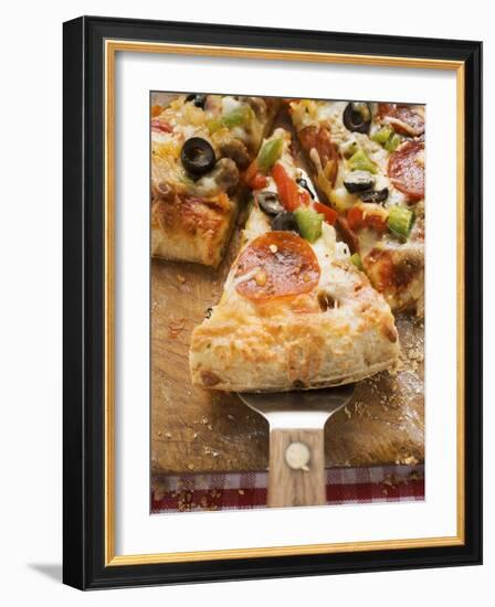 Piece of Pepperoni Pizza with Peppers and Olives on Server-null-Framed Photographic Print