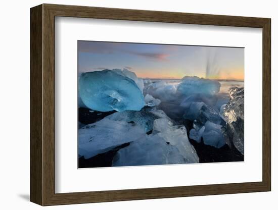 Pieces of glacial ice over black sand being washed by waves, Iceland-Raul Touzon-Framed Photographic Print