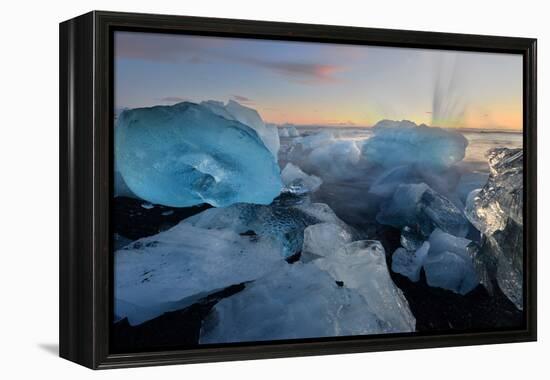 Pieces of glacial ice over black sand being washed by waves, Iceland-Raul Touzon-Framed Premier Image Canvas