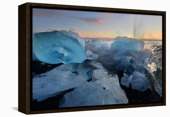 Pieces of glacial ice over black sand being washed by waves, Iceland-Raul Touzon-Framed Premier Image Canvas