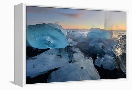 Pieces of glacial ice over black sand being washed by waves, Iceland-Raul Touzon-Framed Premier Image Canvas