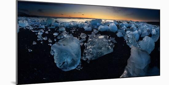 Pieces of glacial ice over black sand being washed by waves, Iceland-Raul Touzon-Mounted Photographic Print