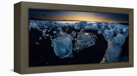 Pieces of glacial ice over black sand being washed by waves, Iceland-Raul Touzon-Framed Premier Image Canvas