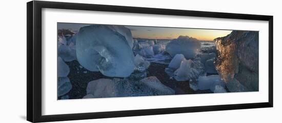 Pieces of glacial ice over black sand being washed by waves, Iceland-Raul Touzon-Framed Photographic Print