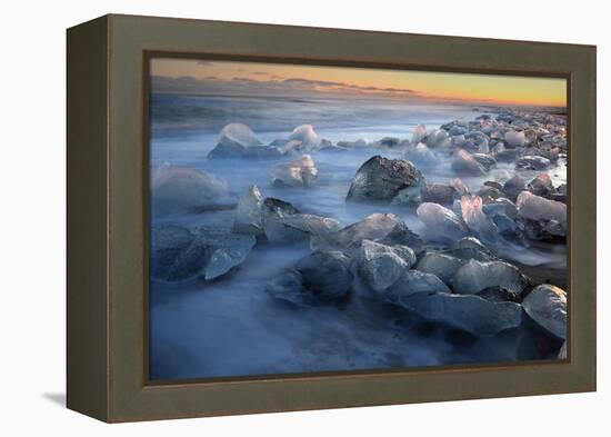 Pieces of glacial ice over black sand being washed by waves, Iceland-Raul Touzon-Framed Premier Image Canvas